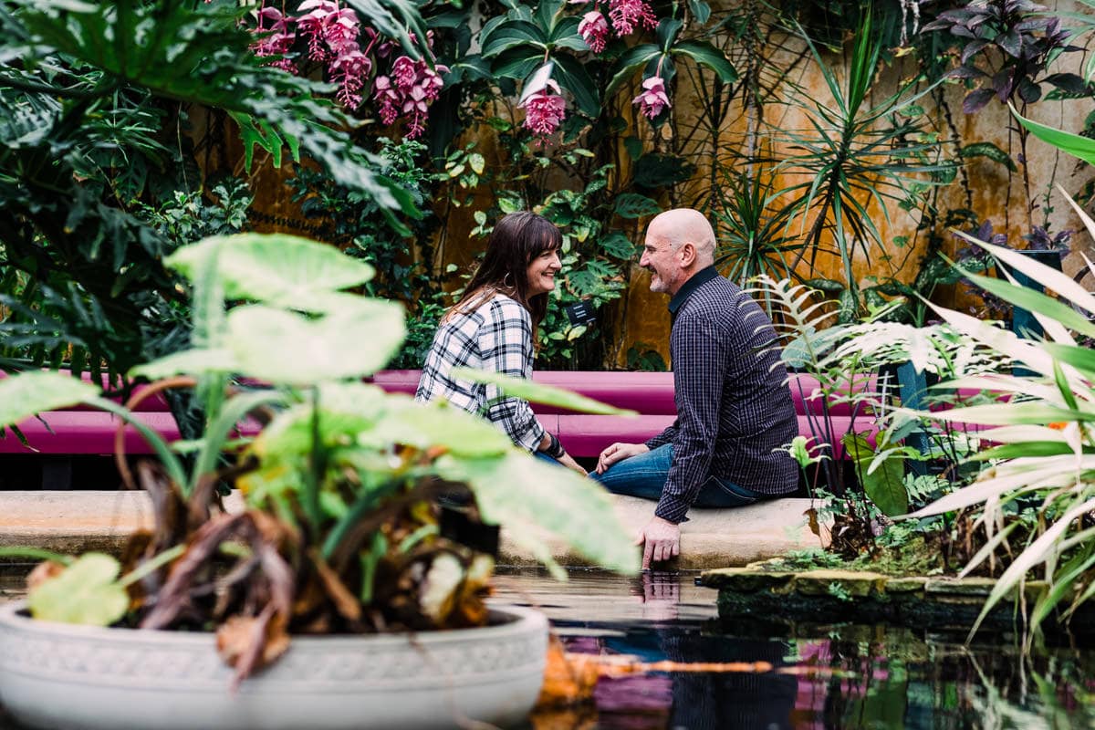 couple sat at pond at Birmingham Botanical Gardens