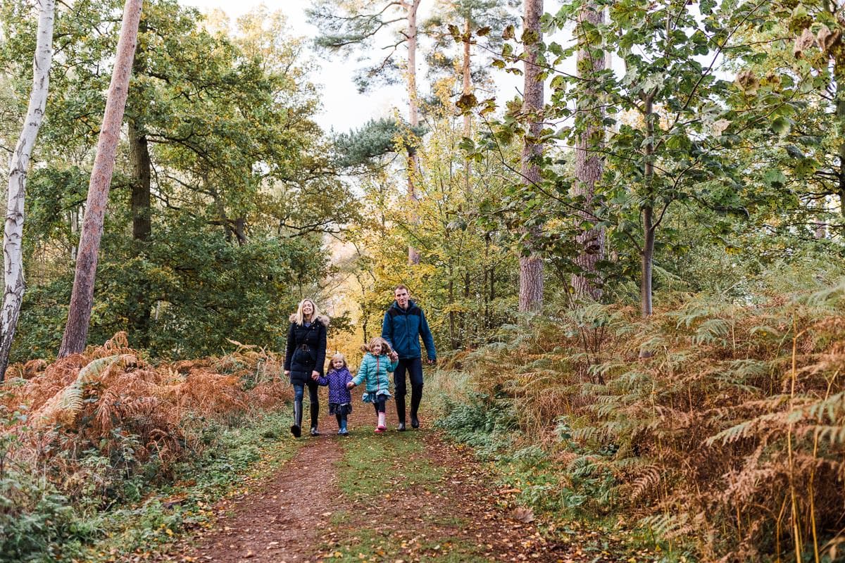 family in autumn leaves in Bedfordshire