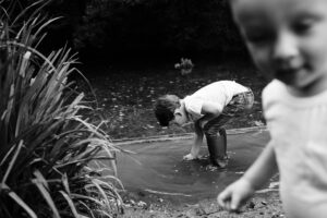 Brothers playing in stream